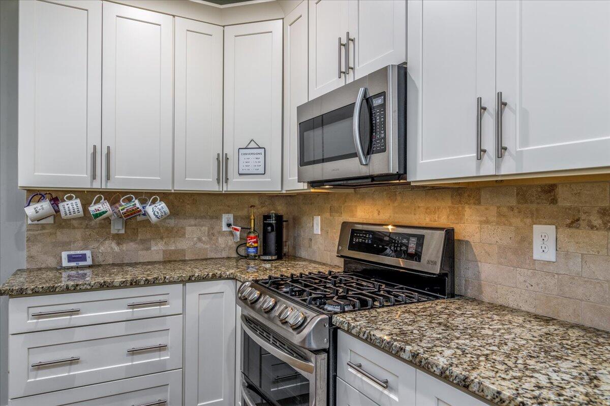 4277 Daugherty Road Salem, VA 24153 - Photo 14 of 48 a kitchen with granite countertop cabinets stainless steel appliances and a counter space
