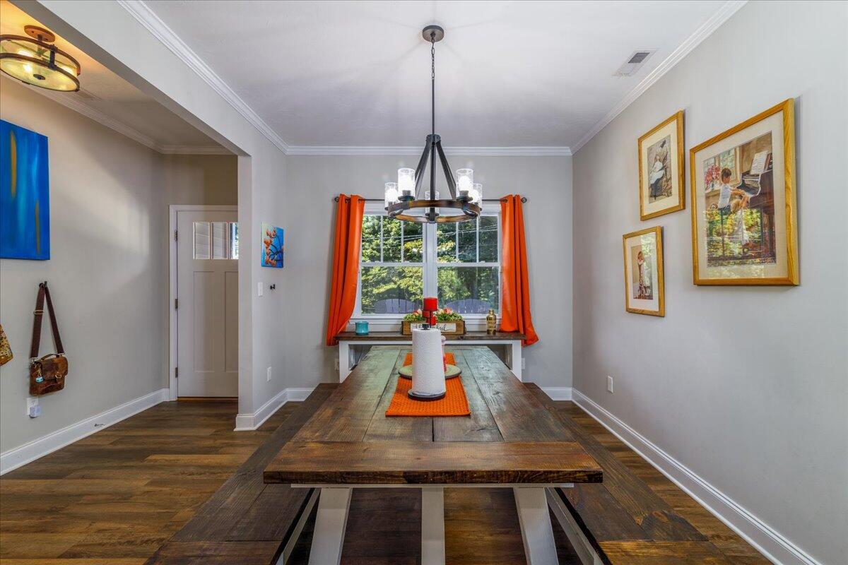4277 Daugherty Road Salem, VA 24153 - Photo 16 of 48 a dining room with table chairs and wooden floor