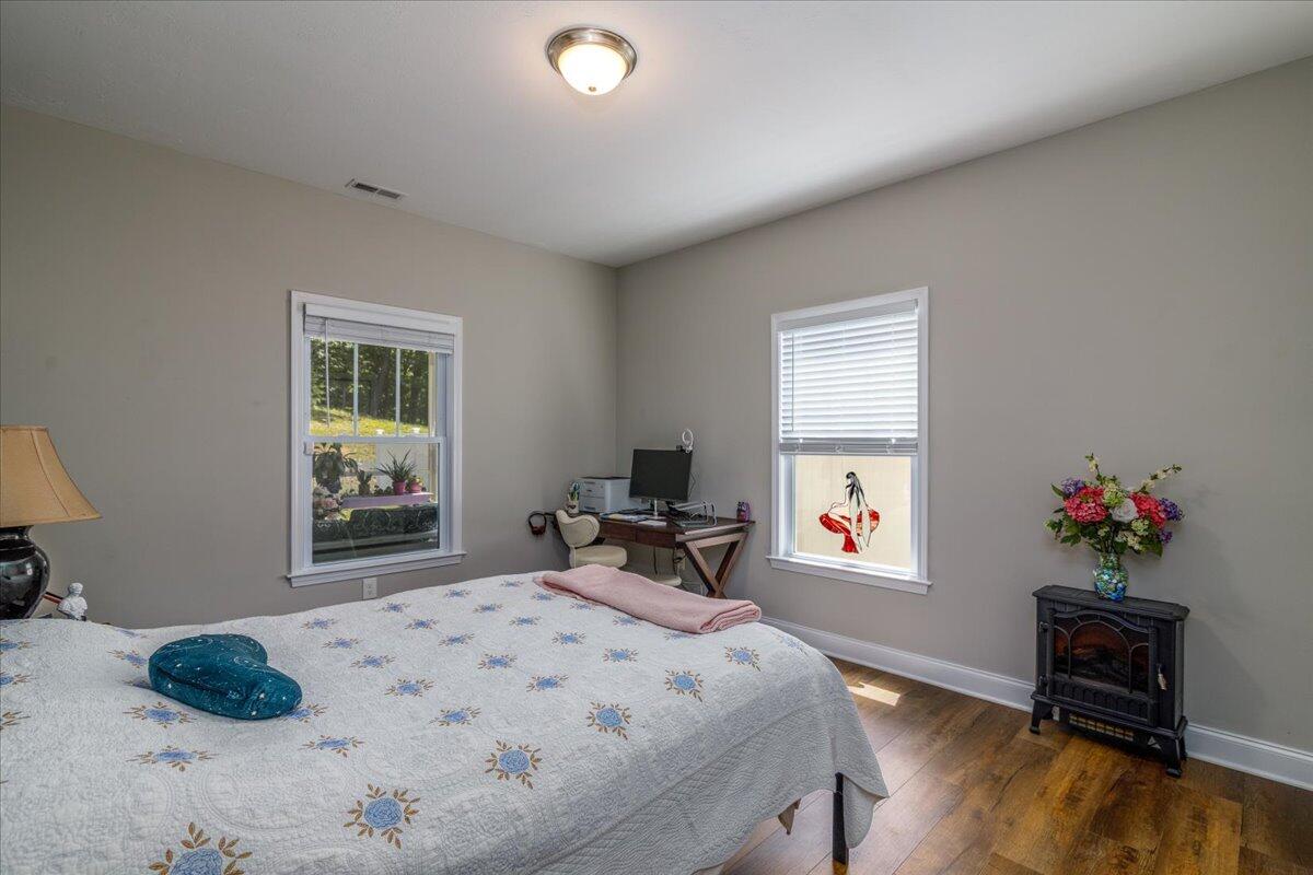 4277 Daugherty Road Salem, VA 24153 - Photo 19 of 48 a bedroom with a bed and wooden floor