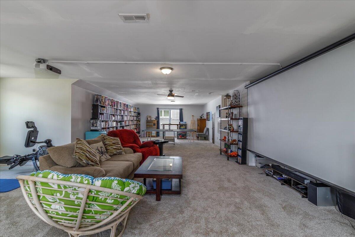 4277 Daugherty Road Salem, VA 24153 - Photo 25 of 48 a living room with furniture a fireplace and a chandelier