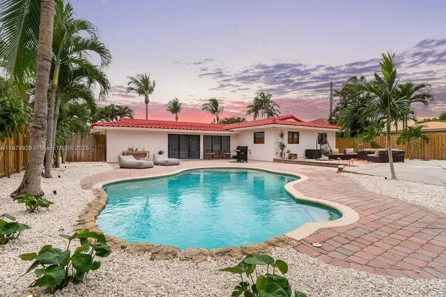 a view of a swimming pool with a lounge chairs