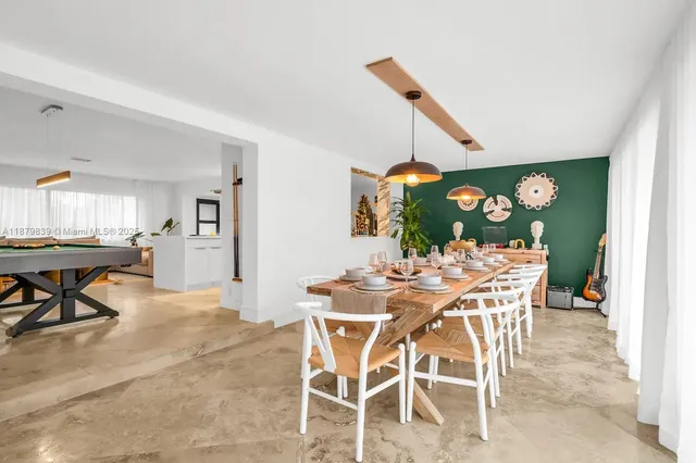 a dining room with furniture and window