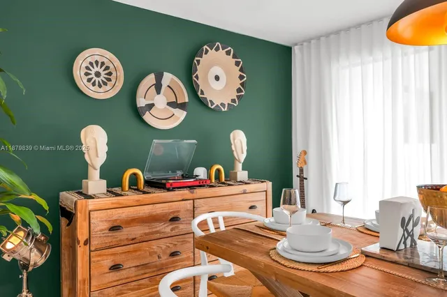 a bedroom with a bed potted plant with the view of mirror