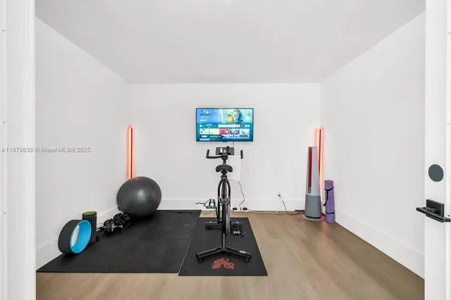 a bathroom with a sink mirror and toilet