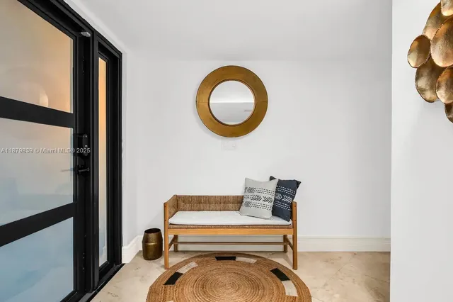 a room with a chair and a window