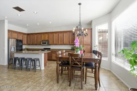a living room with furniture and a view of kitchen