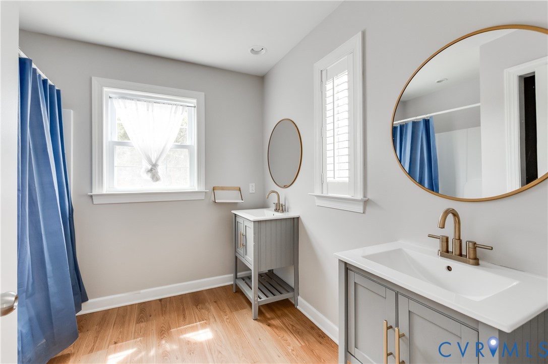 1474 Welsh Tract Road Charlotte Court House, VA 23923 - Photo 29 of 48 Dual vanity bathroom featuring wood-finish floorin