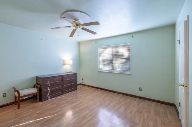 a bathroom with a sink vanity mirror and toilet