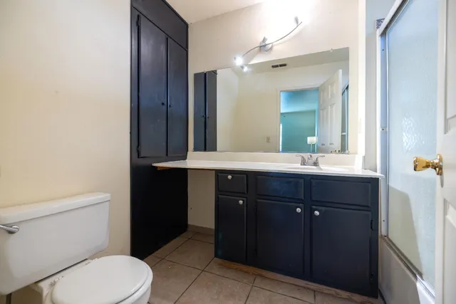 a bathroom with a sink a vanity and a mirror