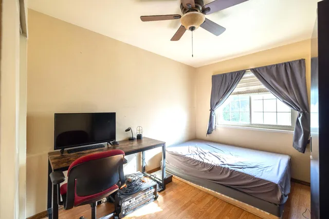 a view of a hallway with staircase and floors
