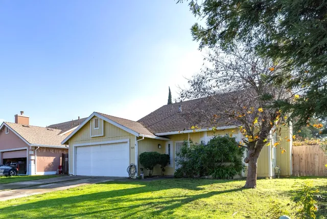 a front view of a house with a yard