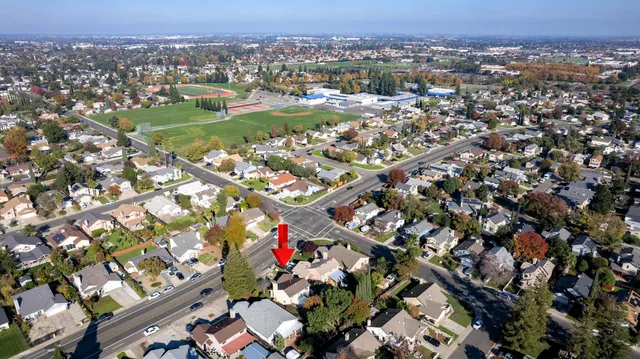 an aerial view of residential houses with outdoor space