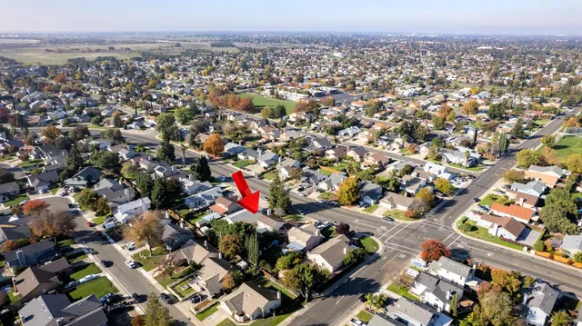 an aerial view of multiple houses with outdoor space