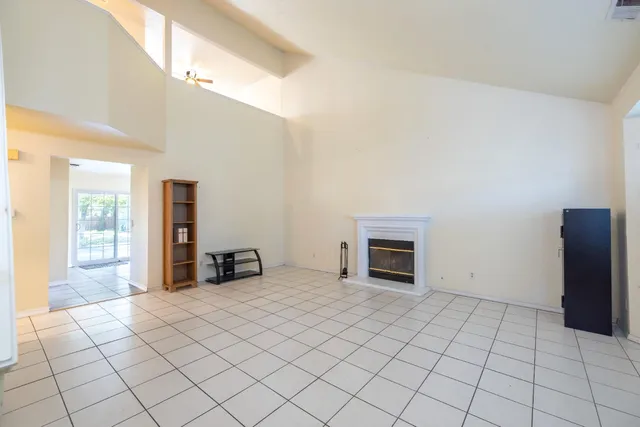 a bedroom with a bed and a fireplace