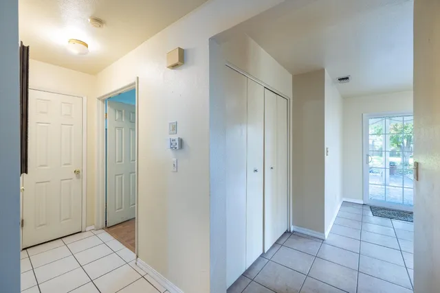 a kitchen with granite countertop a stove a sink and a microwave