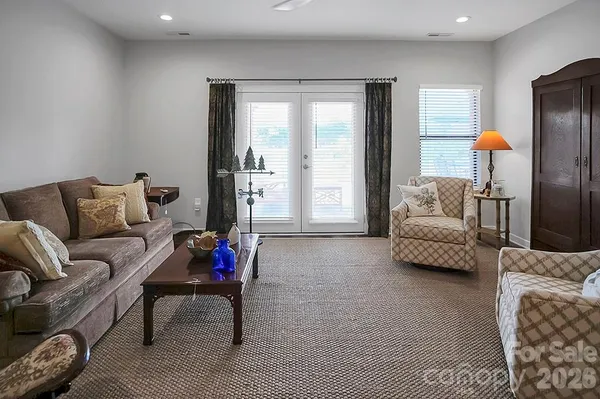 a bedroom with a bed and a chair