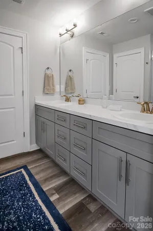 a bedroom with a bed and a table