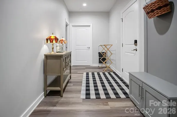 a bathroom with a granite countertop toilet and a sink