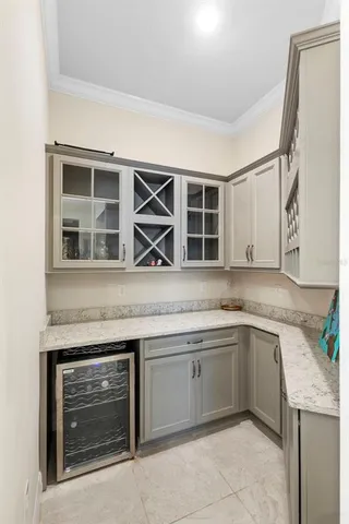 a kitchen with a sink and a refrigerator