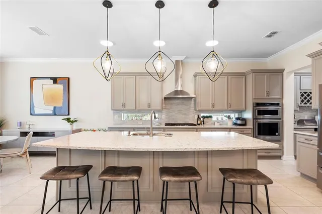 a room with a bed and a chandelier