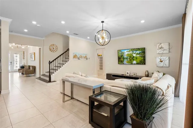 a spacious bedroom with a bed and a refrigerator