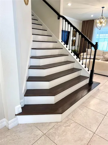 a living room with furniture gym equipment and a flat screen tv