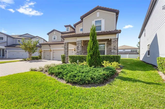 a front view of a house with garden