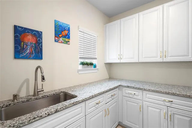 a view of a patio with table and chairs