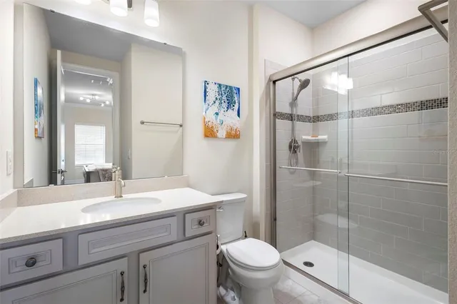 an aerial view of residential house with an outdoor space and seating