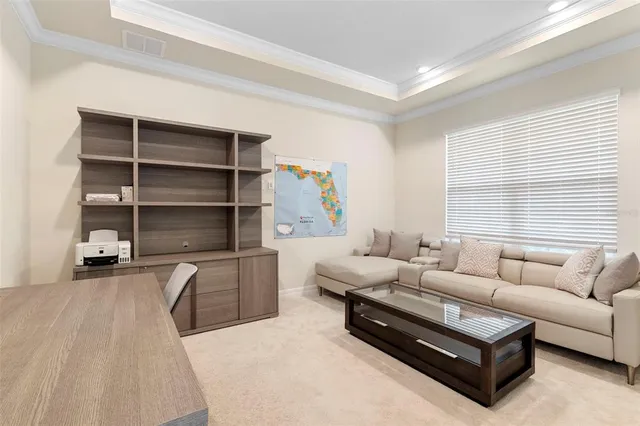 an aerial view of a house with a swimming pool