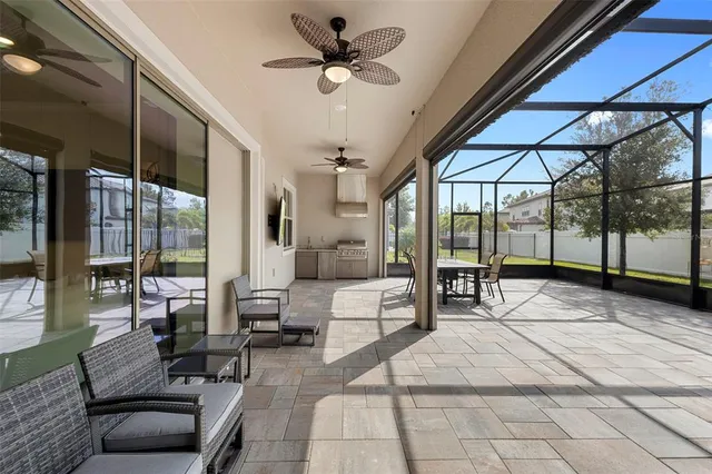 a view of a sign board with flower in front of it