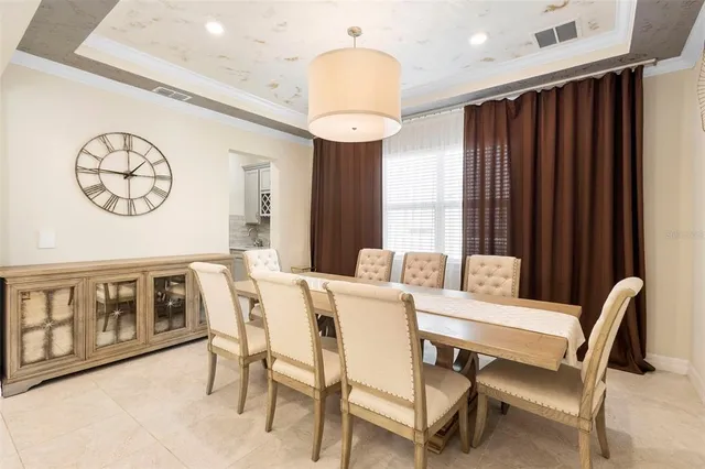 a view of a dining room with furniture and window