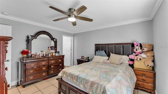 a bedroom with a bed and a dresser