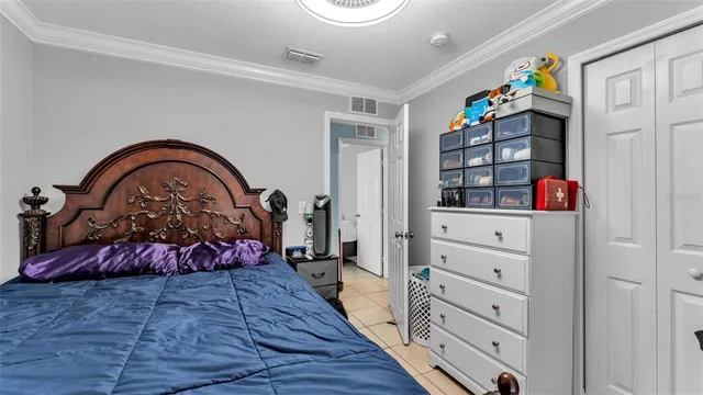 a bedroom with a bed and a dresser