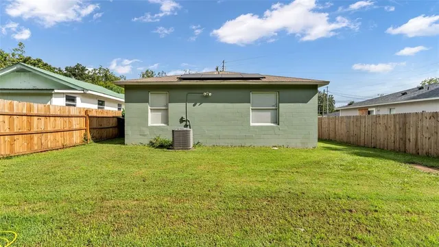 a backyard of a house with lots of green space