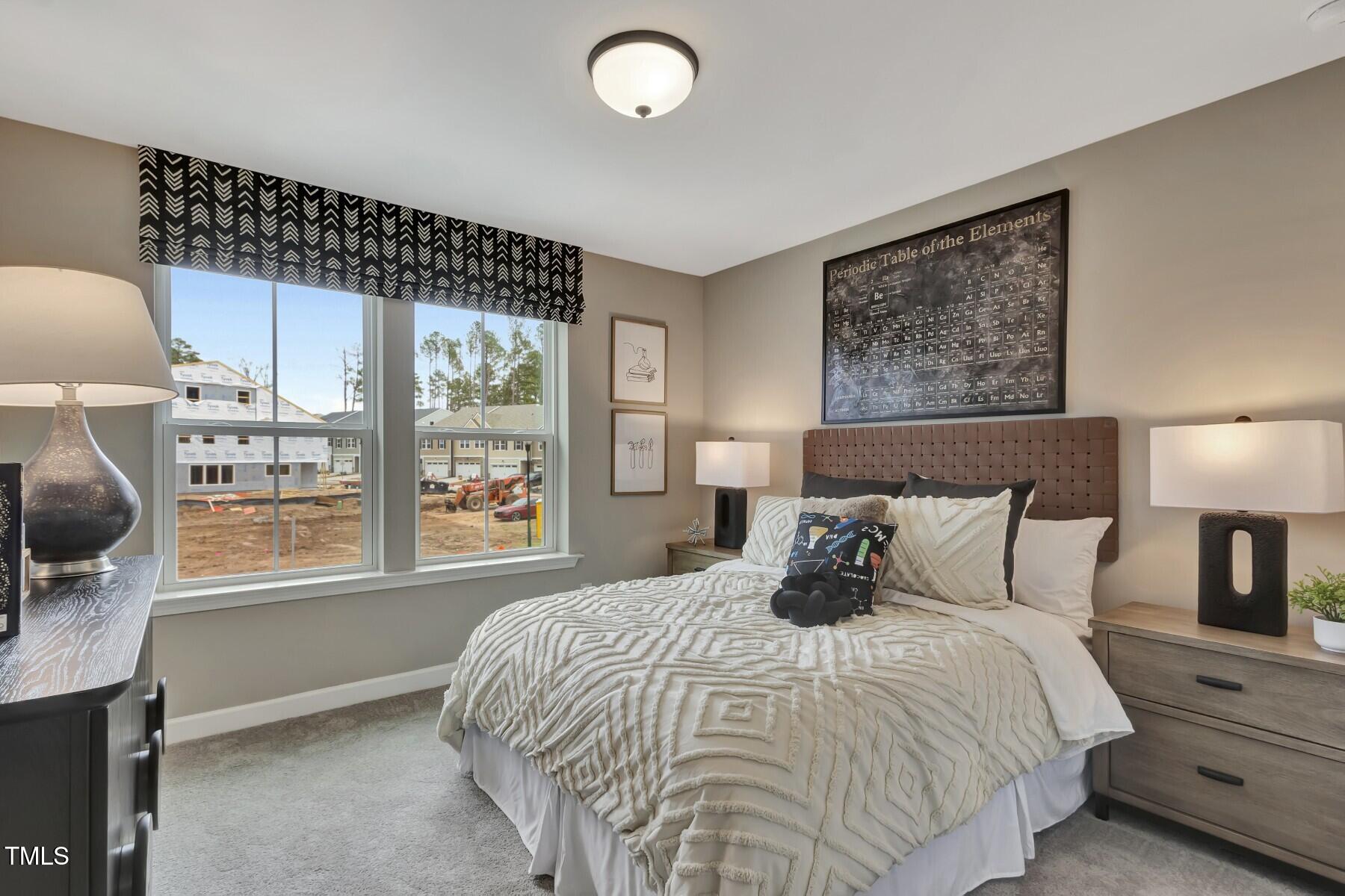 7128 Hubner Place, Unit 35 Cary, NC 27519 - Photo 15 of 17 a bedroom with a bed and window