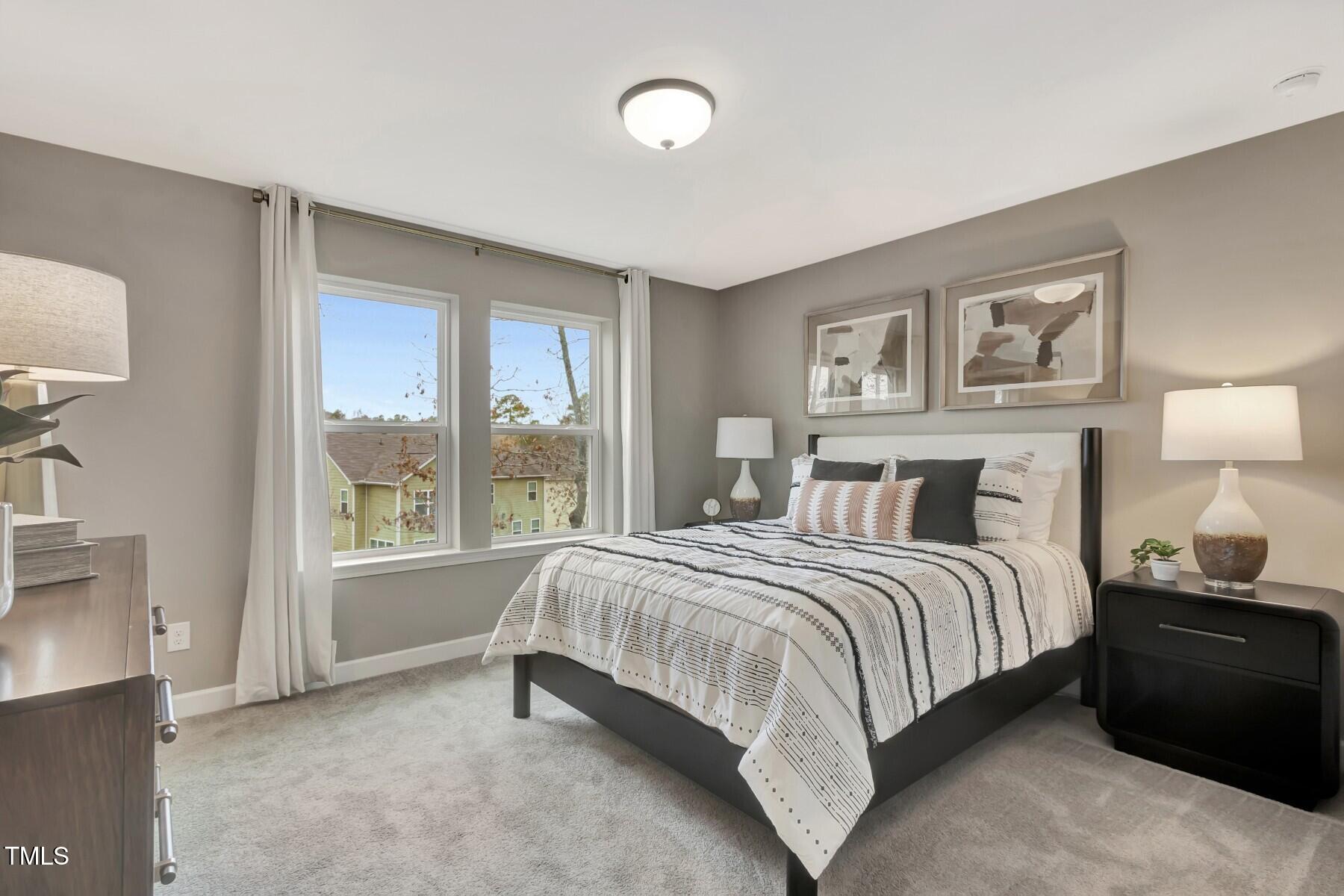 7128 Hubner Place, Unit 35 Cary, NC 27519 - Photo 17 of 17 a bedroom with a bed and a large window