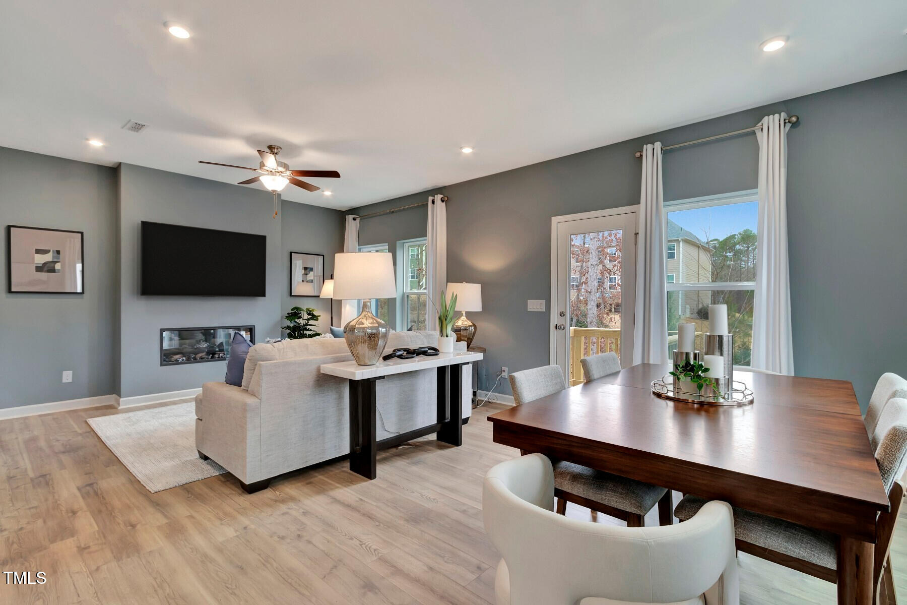 7128 Hubner Place, Unit 35 Cary, NC 27519 - Photo 9 of 17 a living room with furniture flat screen tv and couches