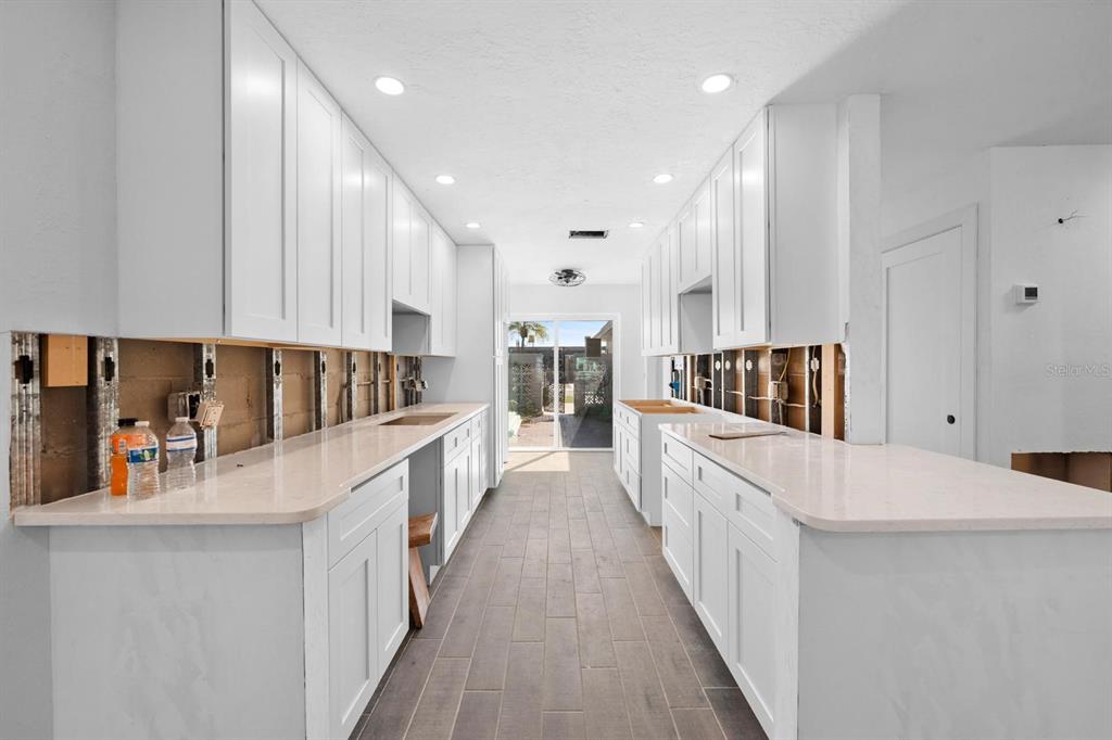 511 Boca Ciega Point Boulevard North St. Petersburg, FL 33708 - Photo 12 of 24 a large kitchen with stainless steel appliances lots of counter space and a sink