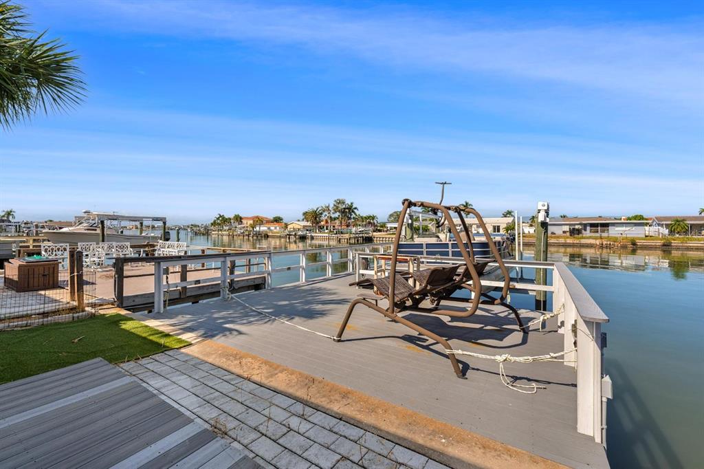 511 Boca Ciega Point Boulevard North St. Petersburg, FL 33708 - Photo 16 of 24 a view of a terrace with chairs