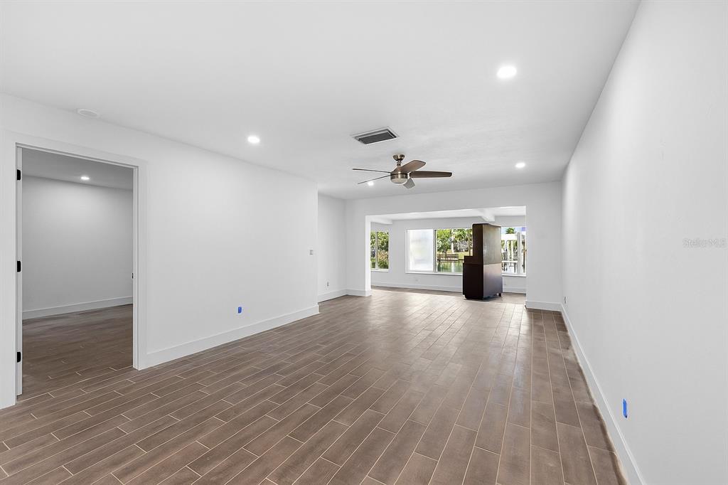 511 Boca Ciega Point Boulevard North St. Petersburg, FL 33708 - Photo 9 of 24 wooden floor in an empty room with a window