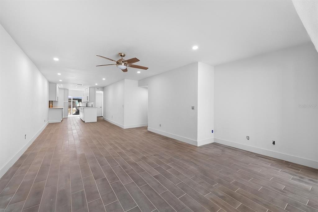 511 Boca Ciega Point Boulevard North St. Petersburg, FL 33708 - Photo 10 of 24 a view of empty room with wooden floor