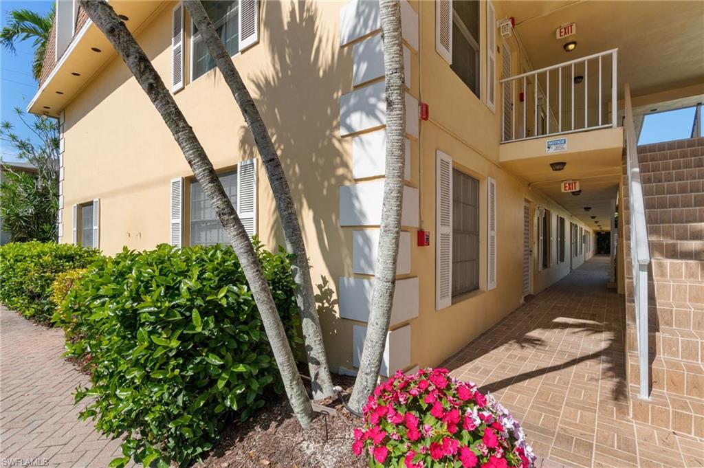 1222 Gordon Drive, Unit 2 Naples, FL 34102 - Photo 3 of 23 a view of entryway with a flower garden