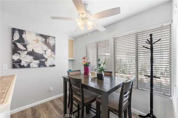 a view of a dining room with furniture and window