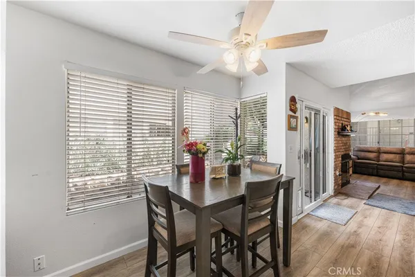 a dining room with furniture and window
