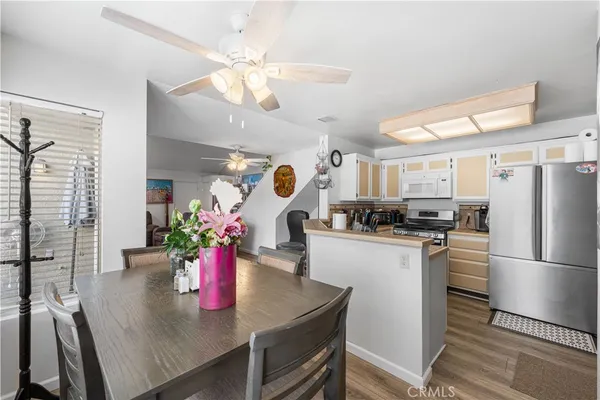 a kitchen with a refrigerator and microwave