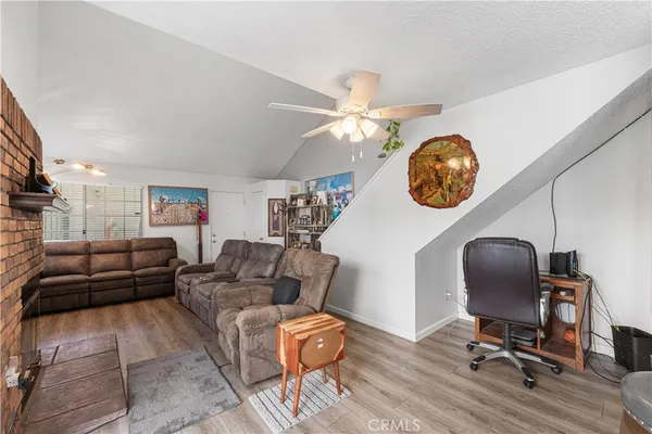 a living room with furniture and a mirror