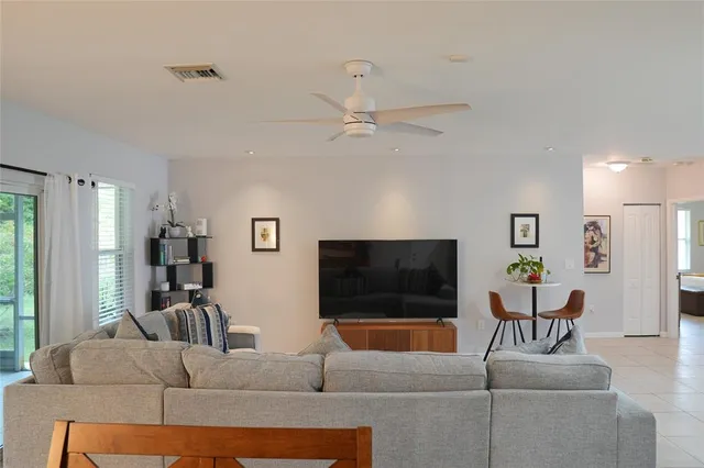 a view of a bathroom with a painting on the wall