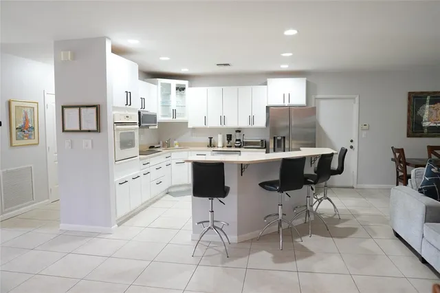 a bedroom with a bed dresser and a window