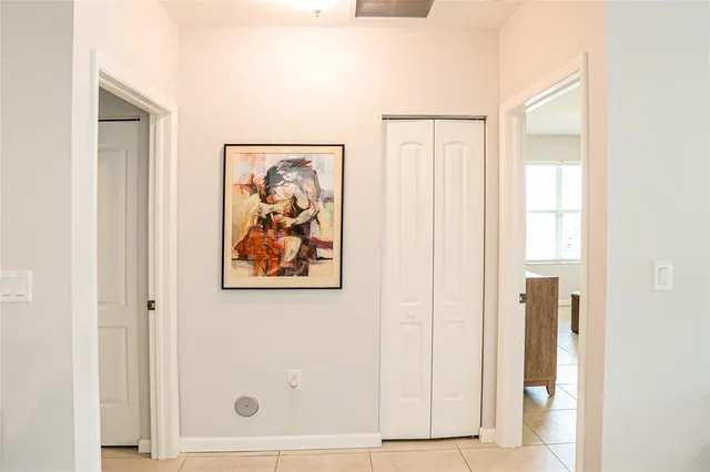 a bedroom with a bed and a mirror